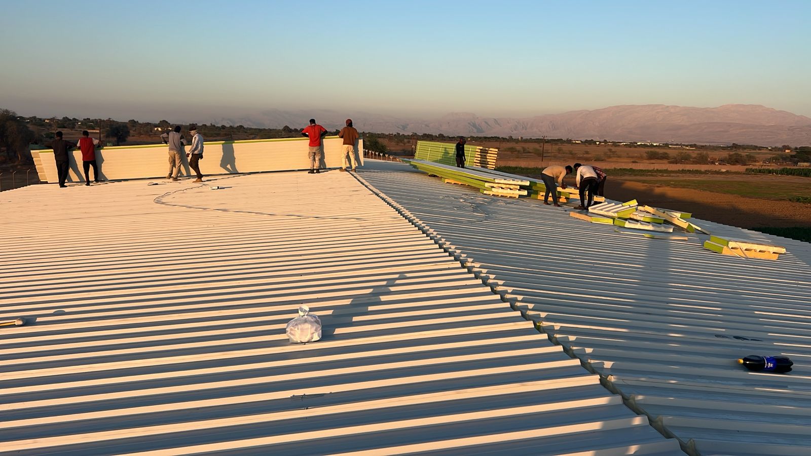 Roofing Installation at Sunset